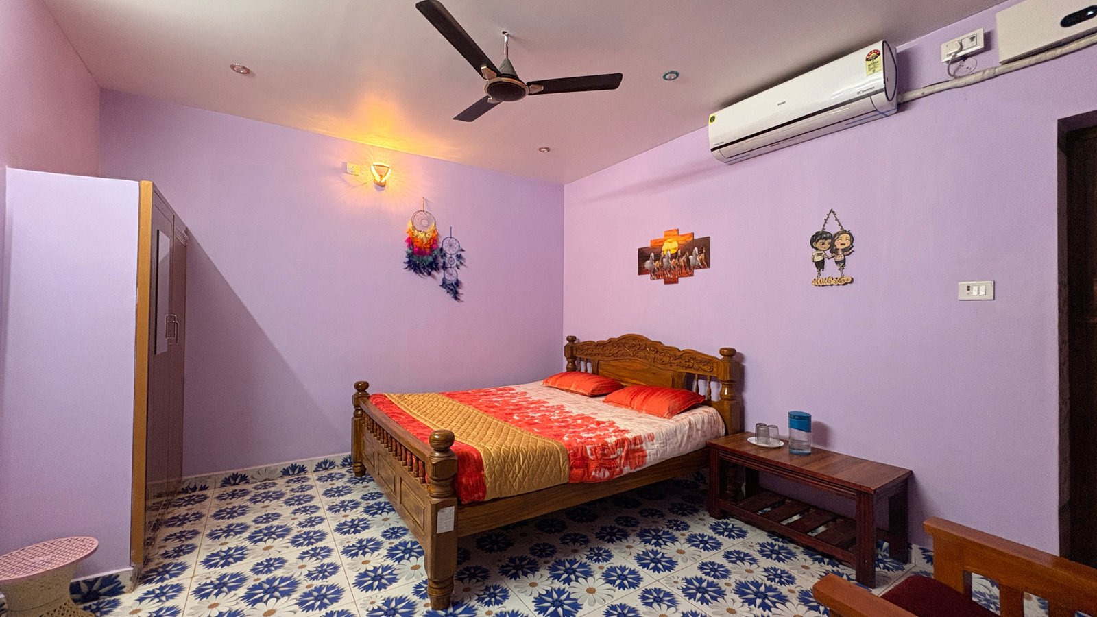 AC Cottage bedroom interior with air conditioning unit and comfortable bed